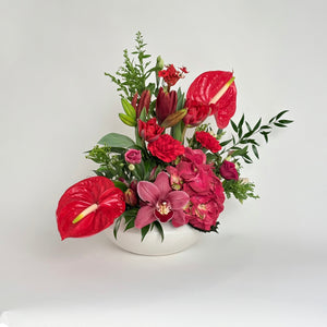 Red Flowers in Ceramic Dish